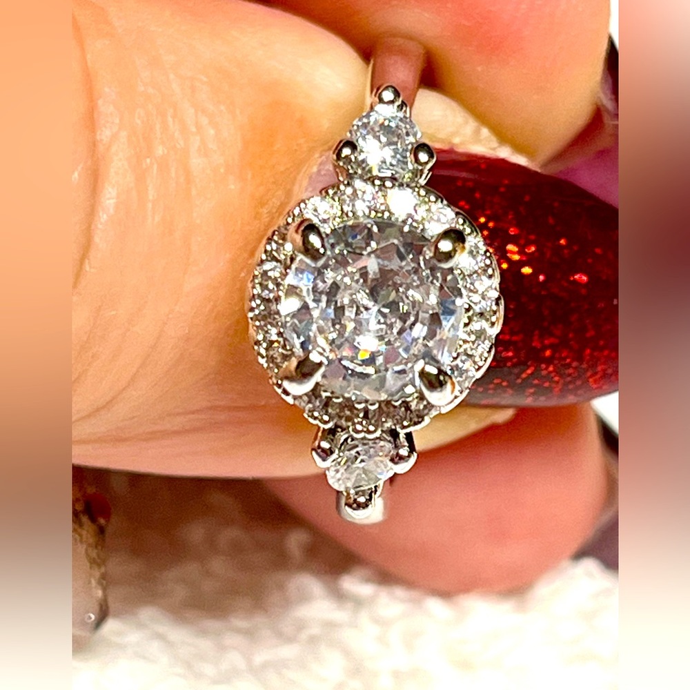 New halo ring with pretty accent stones sturdy not flimsy